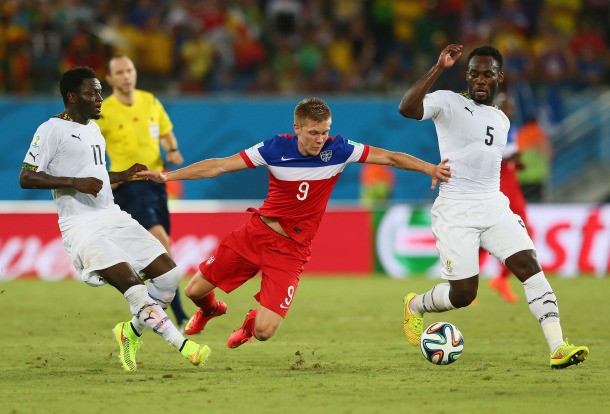 NATAL, BRAZIL - JUNE 16: Aron Johannsson of the United States is challenged by Sulley Muntari (L) and Michael Essien of Ghana during the 2014 FIFA World Cup Brazil Group G match between Ghana and the United States at Estadio das Dunas on June 16, 2014 in Natal, Brazil.  (Photo by Kevin C. Cox/Getty Images)