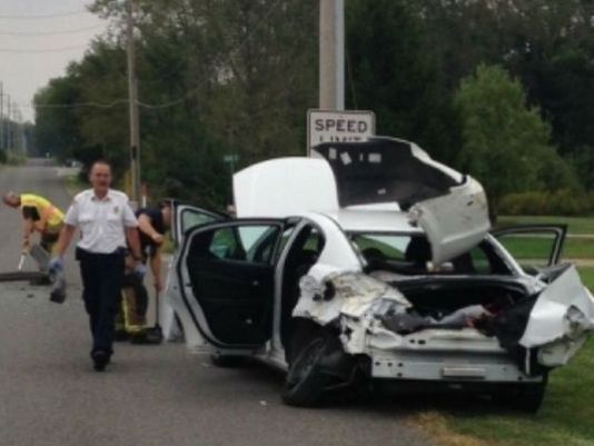 woman crashes car spider